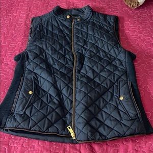 2 different vests black one $15 blue one $20